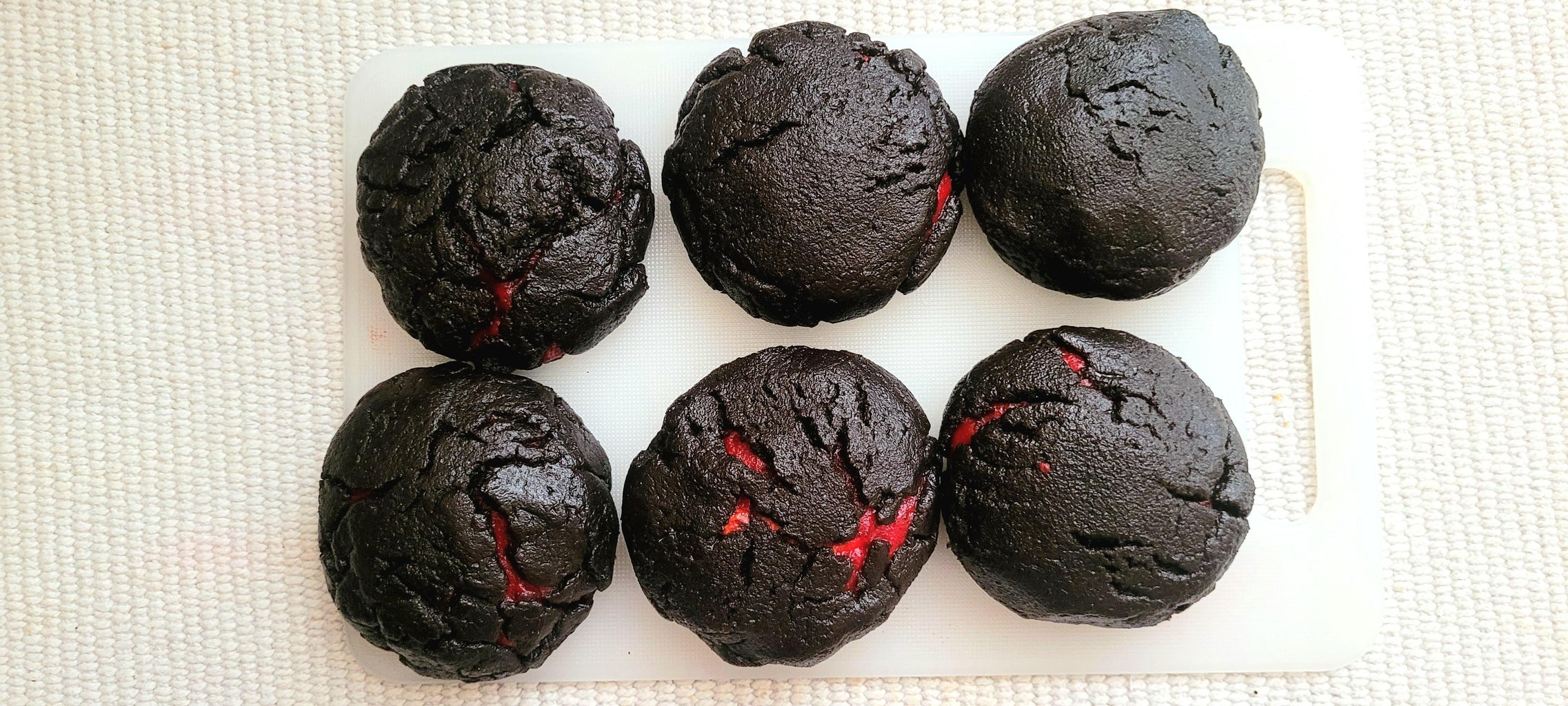 Wrapping the Red Dough Ball With Black Dough